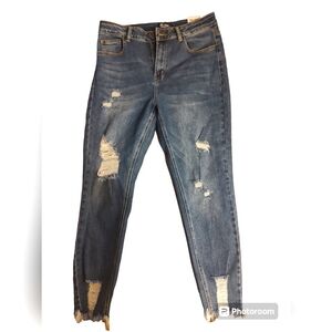 Wax distressed jeans